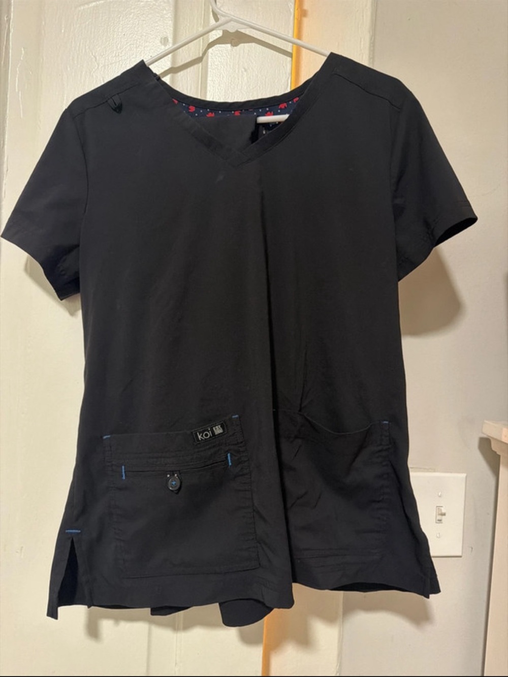 koi Women's Black V-Neck Short Sleeve Scrub Top with flared bottoms